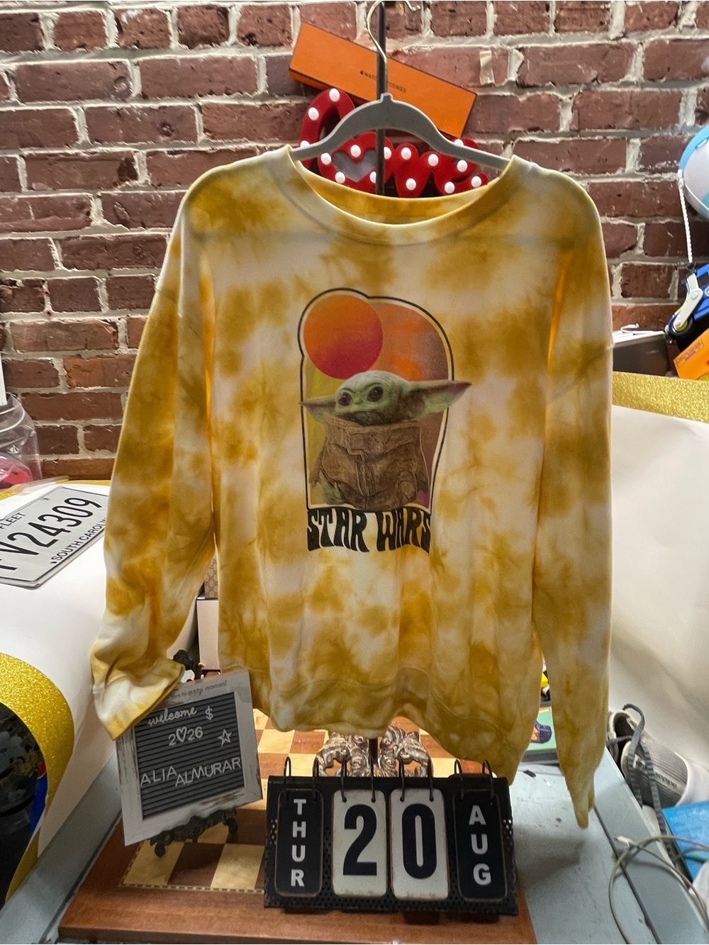 yellow and white tie-dye Star Wars crewneck sweatshirt featuring a retro graphic
